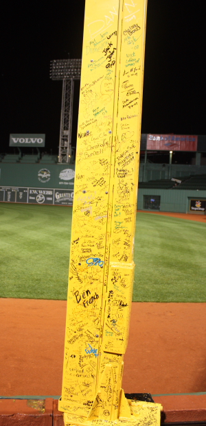 The Pesky Pole -- the nickname for Fenway's right field foul pole -- is covered with fans' autographs.